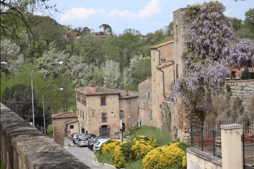 architecture and blossoms near start of Montalceto path in Crete Senesi region near Asciano, Italy