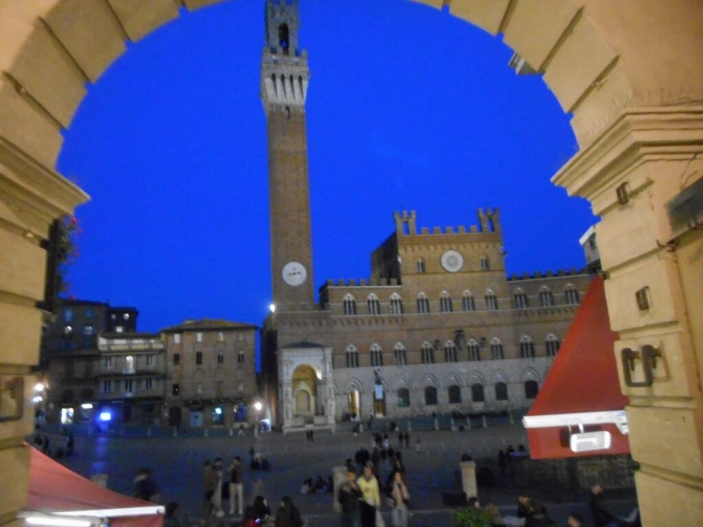 clock tower in Piazza del Campo in Siena in the early evening